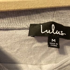 Women’s size Medium. Grey off the shoulder sweatshirt. Ties at end each sleeve.